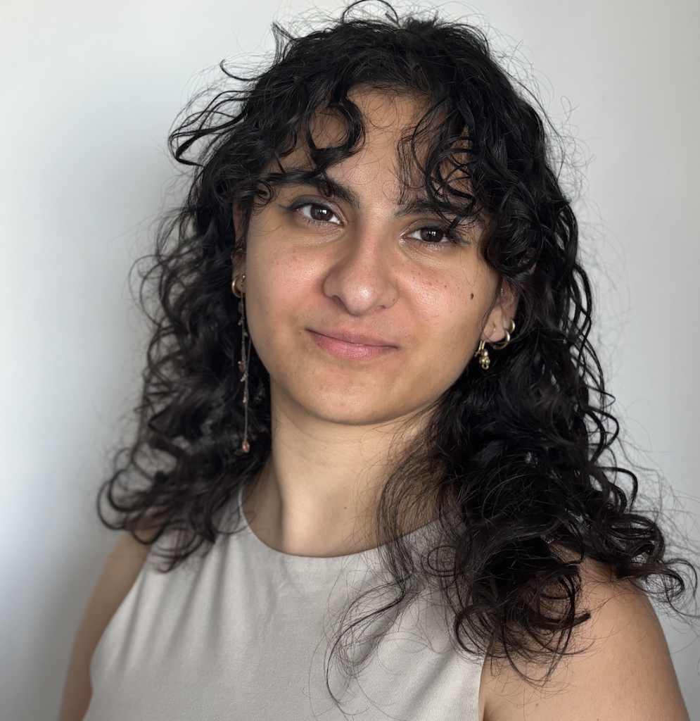 A close-up photo of Yara El Murr wearing a tan top.